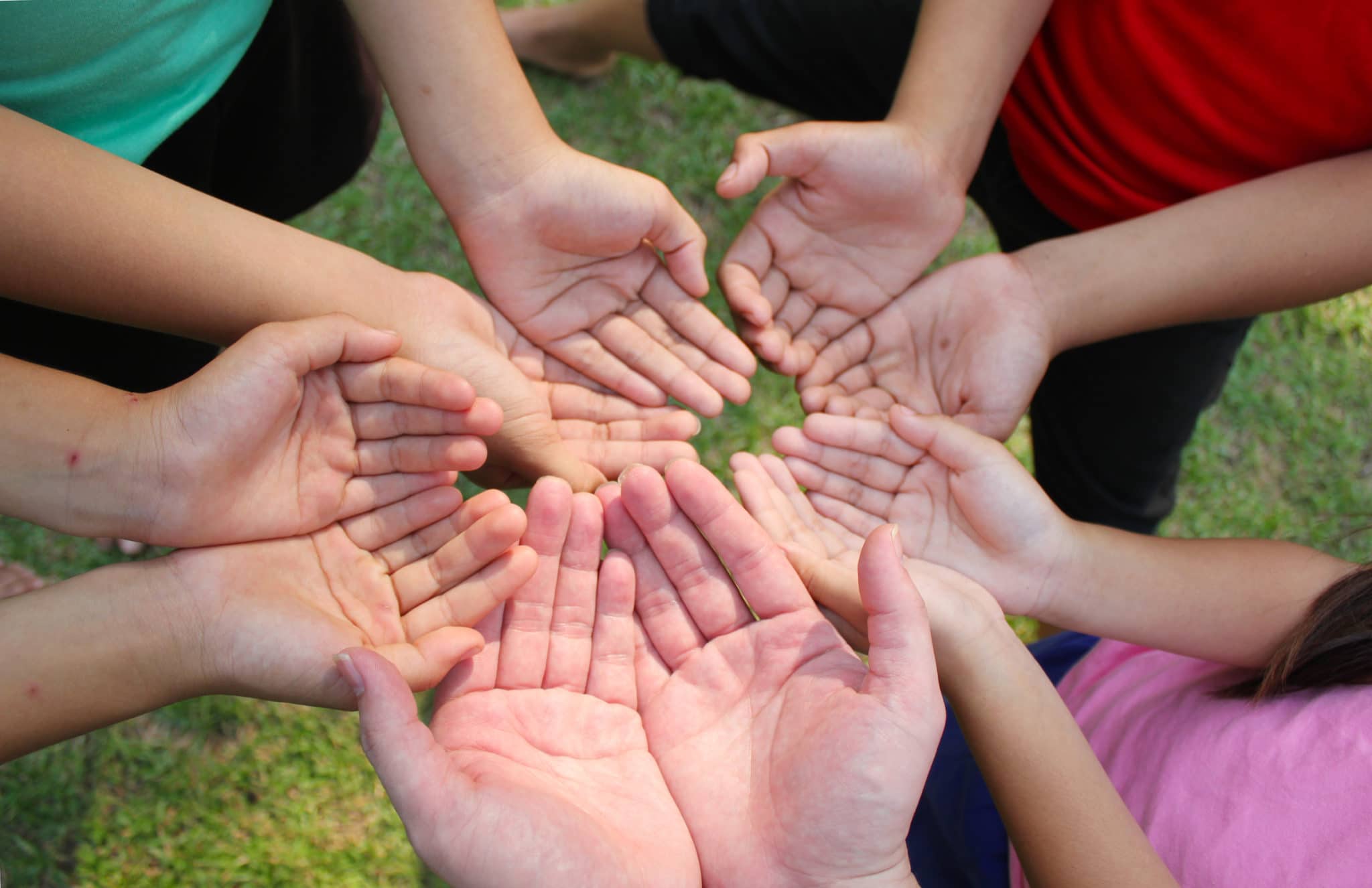 Group-holding-giving-hands